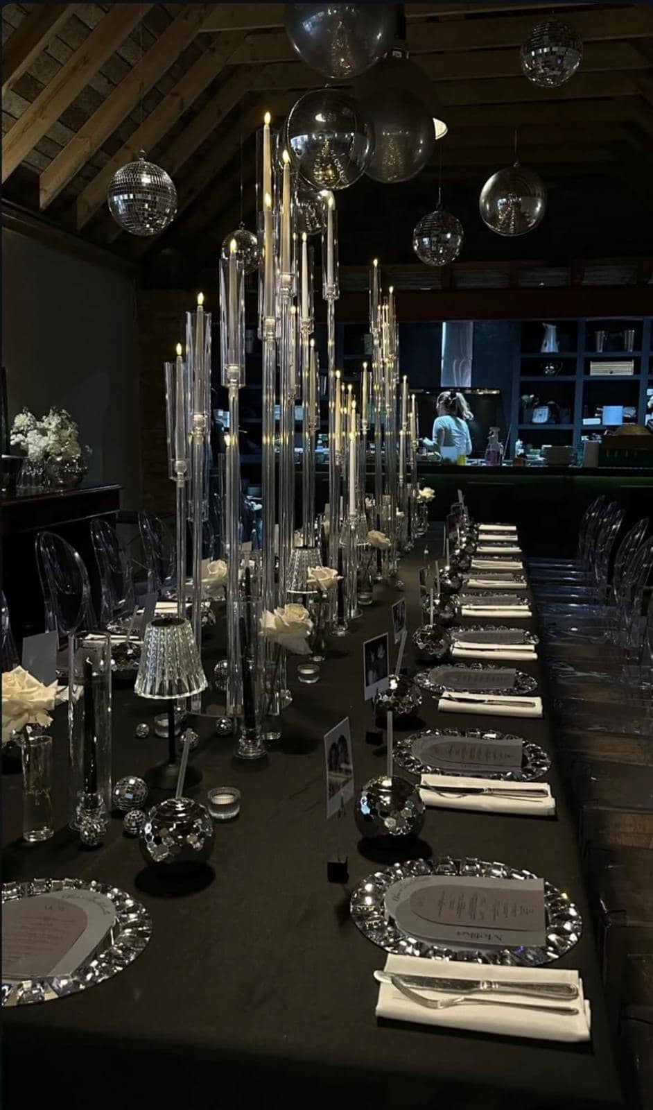 Dramatic black-themed dinner party with crystal candelabras and disco balls