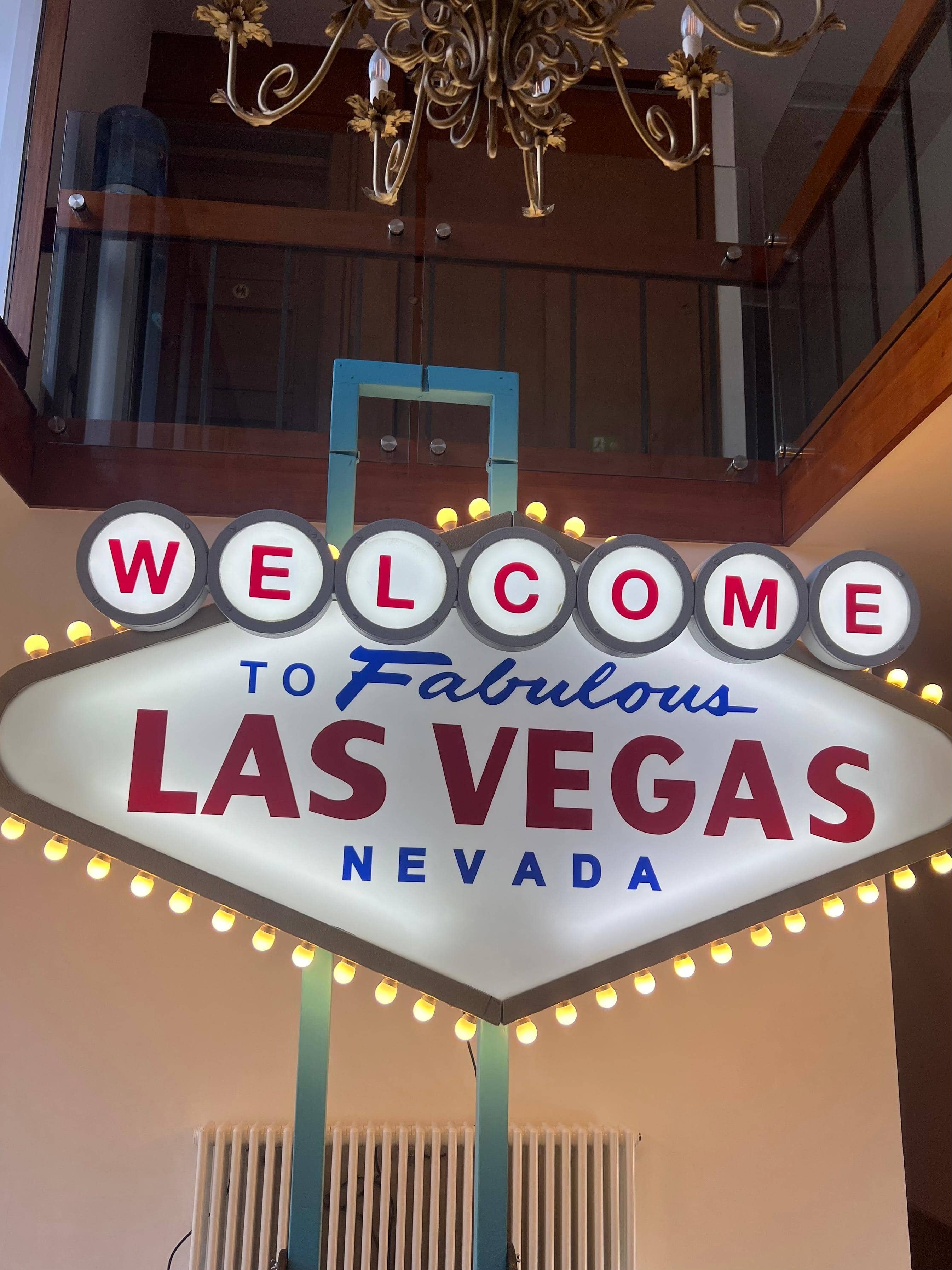 Iconic Las Vegas sign prop with illuminated bulbs in elegant venue