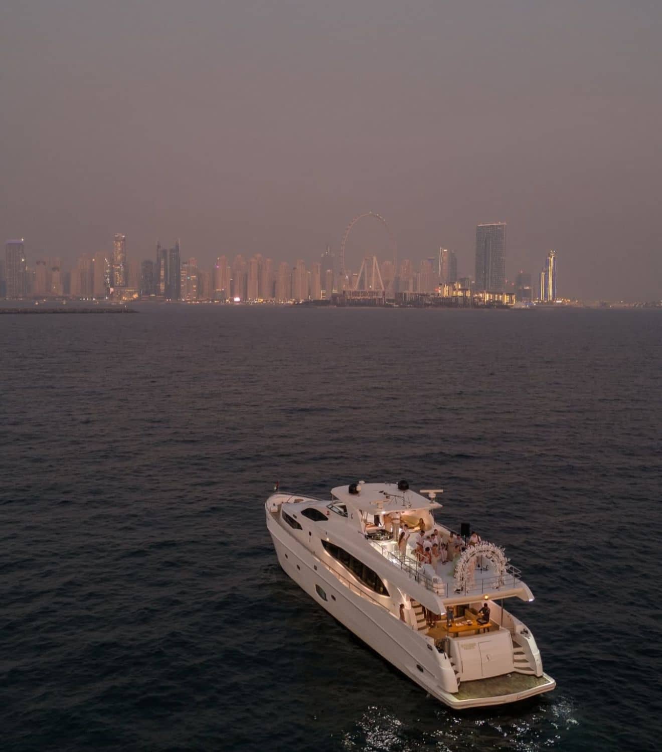 Stunning aerial view of luxury yacht wedding in Dubai at sunset