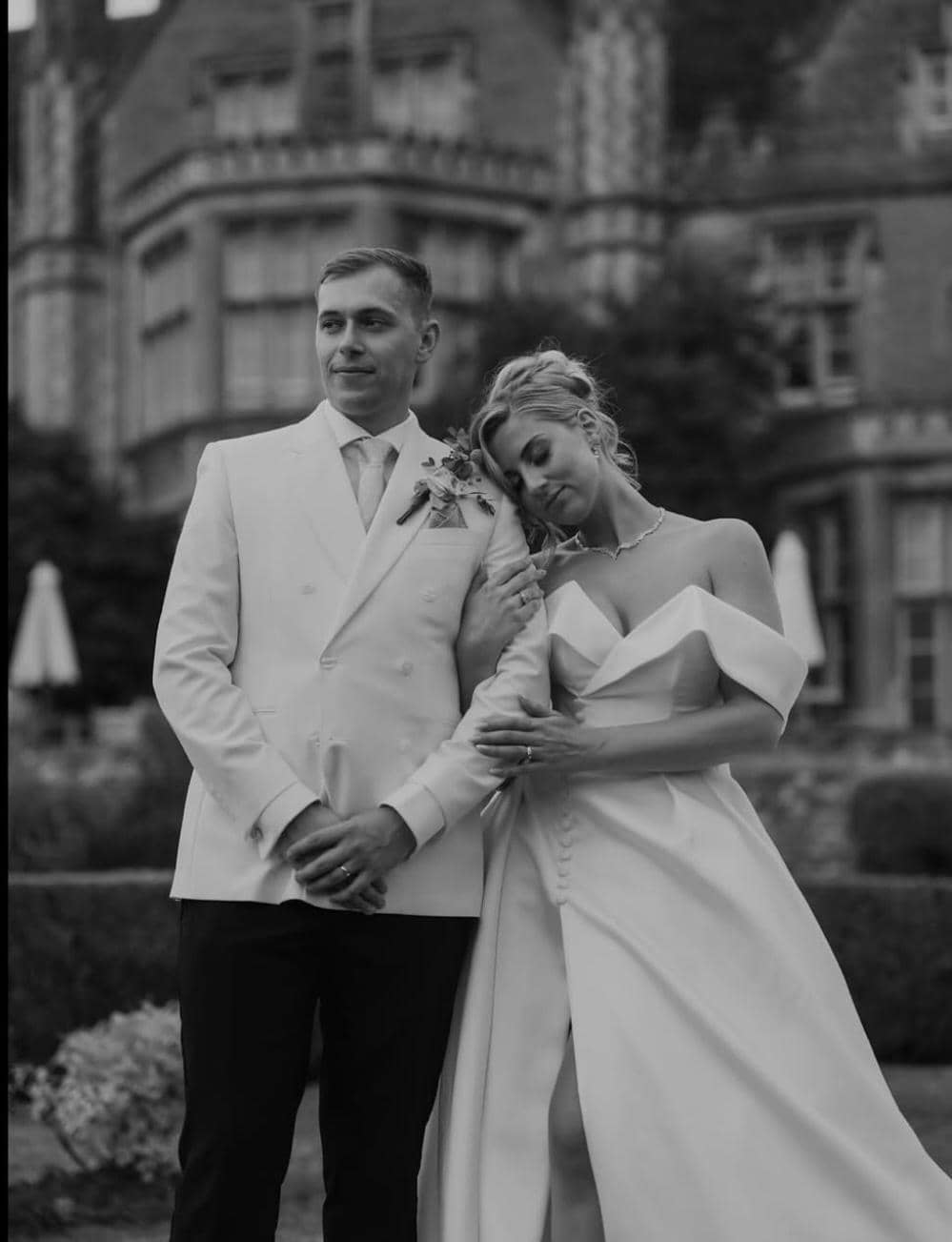 Elegant black and white couple portrait at gothic manor wedding venue